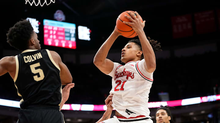 Feb 18, 2024; Columbus, Ohio, USA; Ohio State Buckeyes forward Devin Royal (21) drives to the basket