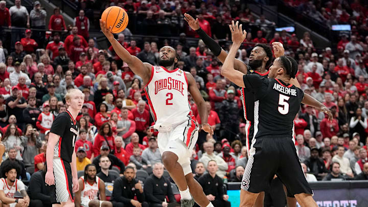 Mar 26, 2024; Columbus, OH, USA; Ohio State Buckeyes guard Bruce Thornton (2) drives to the basket past Georgia Bulldogs center Frank Anselem-Ibe (5) during the second half of the NIT quarterfinals at Value City Arena. Ohio State lost 79-77.