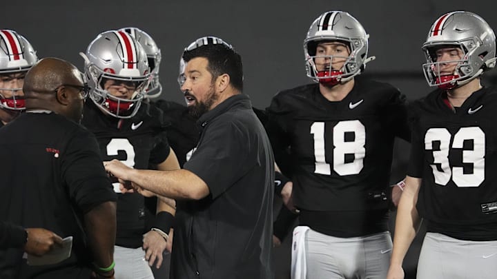 Mar 7, 2024; Columbus, OH, USA; Ohio State Buckeyes head coach Ryan Day talks to quarterbacks during spring football practice at the Woody Hayes Athletic Center.