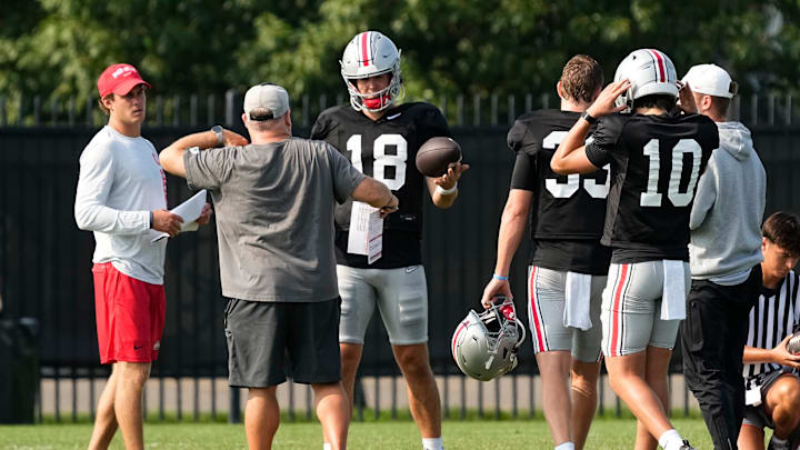 Aug 8, 2024; Columbus, Ohio, USA; Ohio State Buckeyes offensive coordinator Chip Kelly works with quarterback Will Howard (18) during football practice at the Woody Hayes Athletic Complex.