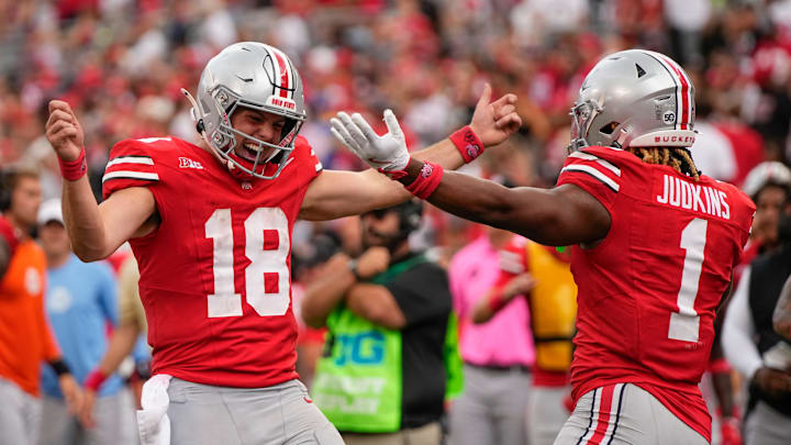 Aug 31, 2024; Columbus, OH, USA; Ohio State Buckeyes quarterback Chad Ray (19) celebrates a touchdown run by running back Quinshon Judkins (1) during the second half of the NCAA football game against the Akron Zips at Ohio Stadium. Ohio State won 52-6.