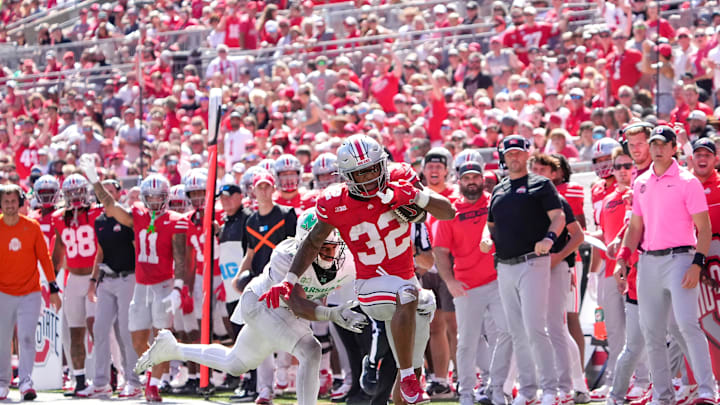 Sep 21, 2024; Columbus, Ohio, USA; Ohio State Buckeyes running back TreVeyon Henderson (32) runs the ball against the Marshall Thundering Herd in the second half at Ohio Stadium on Saturday.