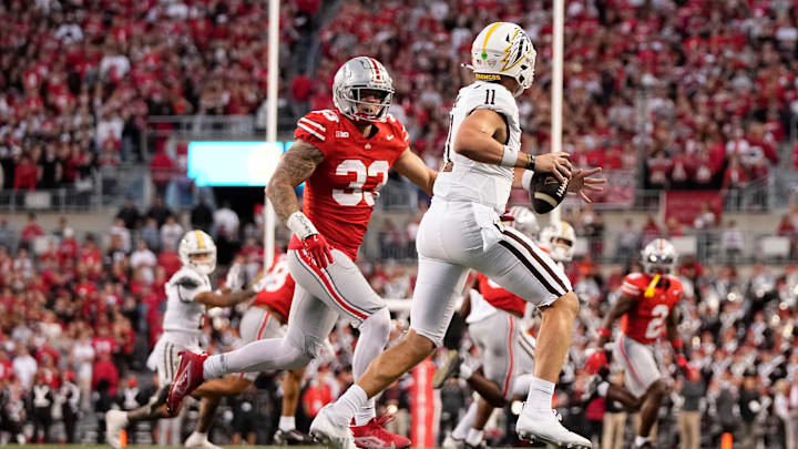 Sep 7, 2024; Columbus, Ohio, USA; Ohio State Buckeyes defensive end Jack Sawyer (33) pursues Western Michigan Broncos quarterback Hayden Wolff (11) during the first half of the NCAA football game at Ohio Stadium.