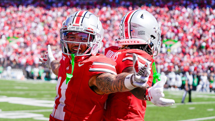 Sep 21, 2024; Columbus, Ohio, USA; Ohio State Buckeyes running back Quinshon Judkins (1) celebrates with Brandon Inniss (11) after Judkins scored a touchdown against the Marshall Thundering Herd in the first half at Ohio Stadium on Saturday.