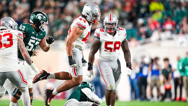 Sep 28, 2024; East Lansing, Michigan, USA; Ohio State Buckeyes defensive end JT Tuimoloau (44) reacts in the first half at Spartan Stadium on Saturday.