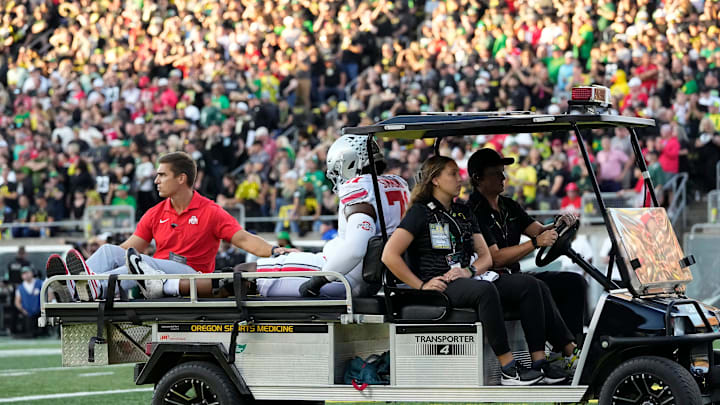Oct 12, 2024; Eugene, Oregon, USA; Ohio State Buckeyes left tackle Josh Simmons is carted off the field during the first half of the NCAA football game against the Oregon Ducks at Autzen Stadium