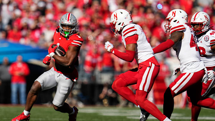 Ohio State Buckeyes running back Quinshon Judkins (1) runs around Nebraska Cornhuskers defensive back DeShon Singleton (8) during the second half of the NCAA football game at Ohio Stadium in Columbus on Saturday, Oct. 26, 2024. Ohio State won 21-17.