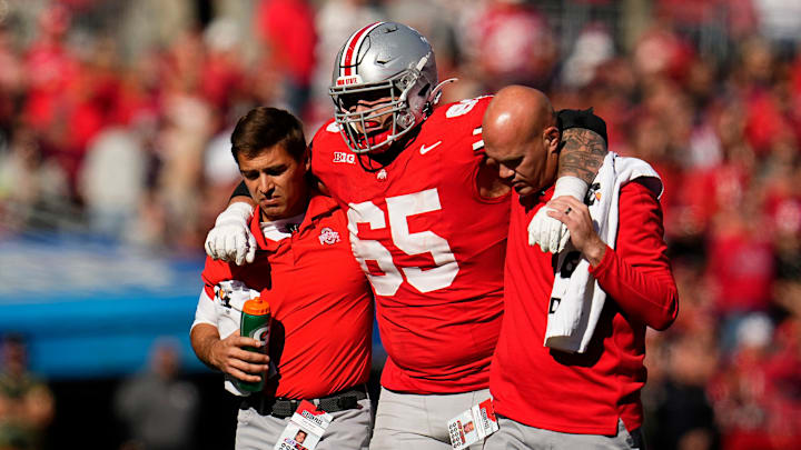 Trainers carry off Ohio State Buckeyes offensive lineman Zen Michalski (65) after during the second half of the NCAA football game against the Nebraska Cornhuskers at Ohio Stadium in Columbus on Saturday, Oct. 26, 2024. Ohio State won 21-17.
