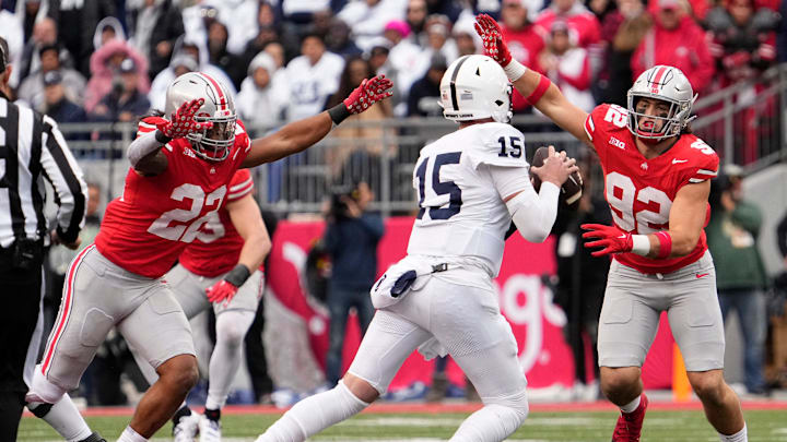 Oct 21, 2023; Columbus, Ohio, USA; Ohio State Buckeyes linebacker Steele Chambers (22) and defensive end Caden Curry (92) pressure Penn State Nittany Lions quarterback Drew Allar (15) during the second half of the NCAA football game at Ohio Stadium. Ohio State won 20-12.