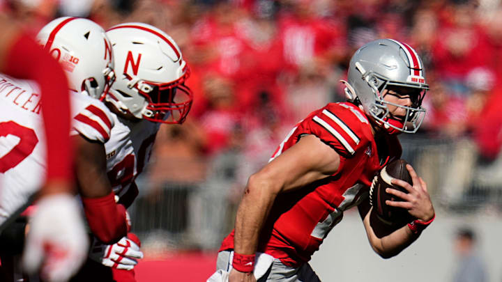 Ohio State Buckeyes quarterback Will Howard (18) scrambles away from pressure during the second half of the NCAA football game against the Nebraska Cornhuskers at Ohio Stadium in Columbus on Saturday, Oct. 26, 2024. Ohio State won 21-17.