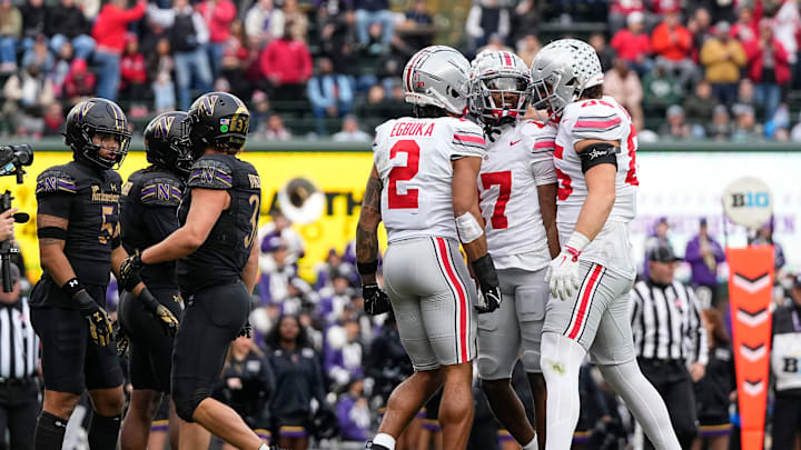 Ohio State Buckeyes wide receiver Emeka Egbuka (2) and tight end Bennett Christian (85) celebrate a touchdown by wide receiver Carnell Tate (17) during the second half of the NCAA football game against the Northwestern Wildcats at Wrigley Field in Chicago on Saturday, Nov. 16, 2024. Ohio State won 31-7.