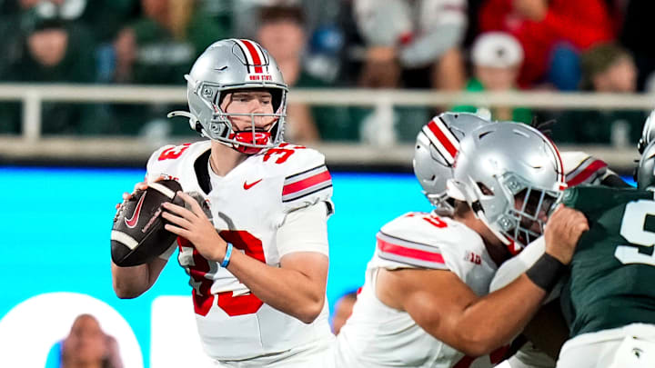 Sep 28, 2024; East Lansing, Michigan, USA; Ohio State Buckeyes quarterback Devin Brown (33) looks to pass the ball in the second half at Spartan Stadium on Saturday.