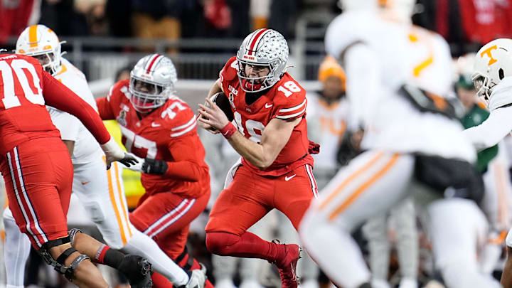 Ohio State Buckeyes quarterback Will Howard (18) rushes during the second half of the College Football Playoff first round game against the Tennessee Volunteers at Ohio Stadium in Columbus on Dec. 22, 2024. Ohio State won 42-17.