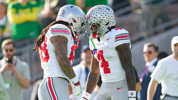 Ohio State Buckeyes wide receiver Jeremiah Smith (4) celebrates a touchdown with otight end Gee Scott Jr. (88) during the first half of the College Football Playoff quarterfinal against the Oregon Ducks at the Rose Bowl in Pasadena, Calif. on Jan. 1, 2025.