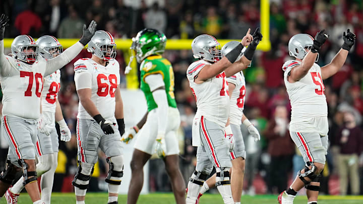 Ohio State Buckeyes offensive linemen cheer during the final seconds of the second half of the College Football Playoff quarterfinal against the Oregon Ducks at the Rose Bowl in Pasadena, Calif. on Jan. 1, 2025. Ohio State won 41-21.
