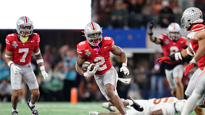 Ohio State Buckeyes safety Caleb Downs (2) returns an interception during the second half of the Cotton Bowl Classic College Football Playoff semifinal game against the Texas Longhorns at AT&T Stadium in Arlington, Texas on Jan. 10, 2025. Ohio State won 28-14.