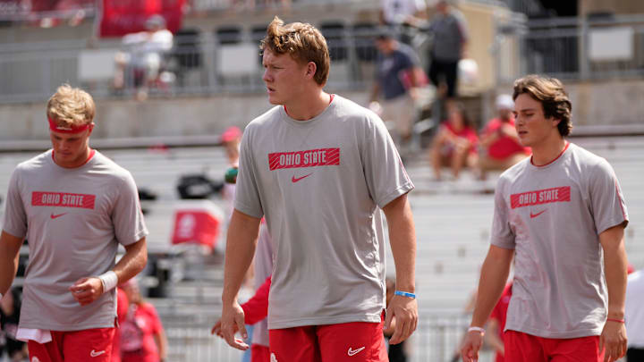 Aug 31, 2024; Columbus, OH, USA; Ohio State Buckeyes quarterback Devin Brown (33) warms up between quarterback Lincoln Kienholz (3) and quarterback Julian Sayin (10) prior to the NCAA football game against the Akron Zips at Ohio Stadium.