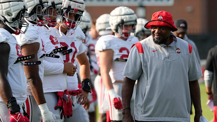 Aug 8, 2024; Columbus, Ohio, USA; Ohio State Buckeyes defensive line coach Larry Johnson talks to players during football practice at the Woody Hayes Athletic Complex.