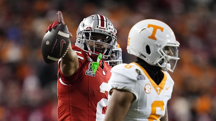 Ohio State Buckeyes wide receiver Emeka Egbuka (2) celebrates a first down catch behind Tennessee Volunteers defensive back Jalen McMurray (6) during the first half of the College Football Playoff first round game at Ohio Stadium in Columbus on Dec. 21, 2024.