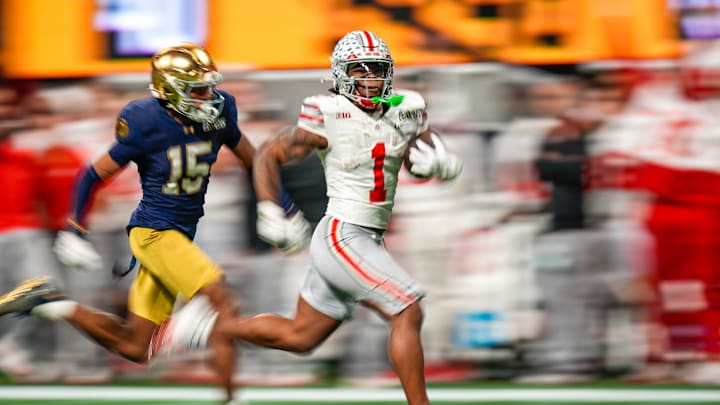 Ohio State Buckeyes running back Quinshon Judkins (1) gets away from the Notre Dame Fighting Irish defense for a long run in the third quarter during the College Football Playoff championship at Mercedes-Benz Stadium in Atlanta on January 20, 2025.