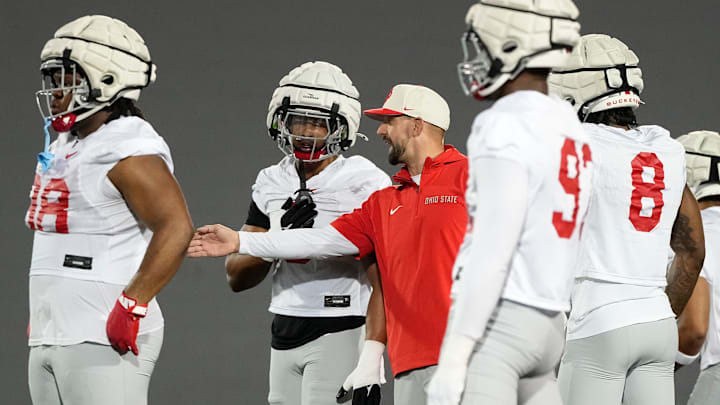 Ohio State Buckeyes linebackers coach James Laurinaitis talk to Sonny Styles during spring football practice at the Woody Hayes Athletic Center in Columbus on March 19, 2025.