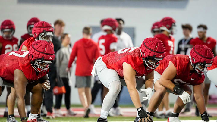 Ohio State Buckeyes offensive lineman Carson Hinzman (75) snaps the ball during spring football practice at the Woody Hayes Athletic Center on March 17, 2025.
