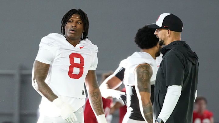Ohio State Buckeyes linebackers coach James Laurinaitis works with linebacker Arvell Reese (8) during spring football practice at the Woody Hayes Athletic Center on March 17, 2025.
