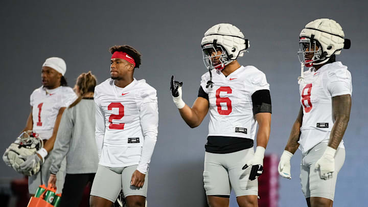 Ohio State Buckeyes linebacker Arvell Reese (8), linebacker Sonny Styles (6), safety Caleb Downs (2) and cornerback Davison Igbinosun (1) work out during spring football practice at the Woody Hayes Athletic Center on March 17, 2025.