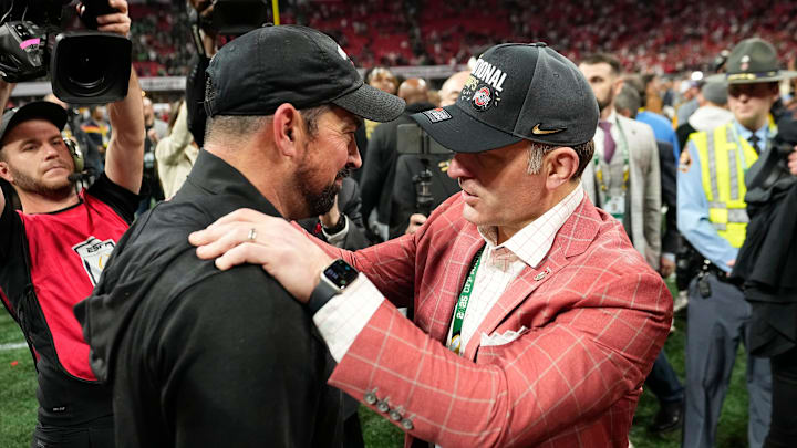 Ohio State Buckeyes head coach Ryan Day gets a hug from athletic director Ross Bjork following the 34-23 win over the Notre Dame Fighting Irish to win the College Football Playoff National Championship at Mercedes-Benz Stadium in Atlanta on Jan. 21, 2025.