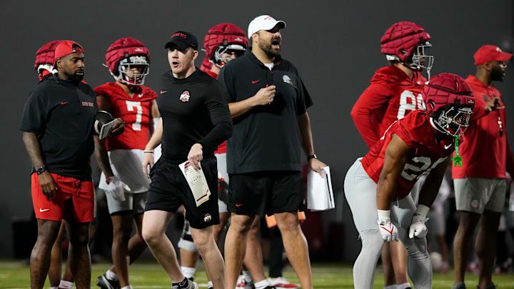 Ohio State Buckeyes assistants Keenan Bailey and Tyler Bowen run players through drills during spring football practice at the Woody Hayes Athletic Center in Columbus on March 19, 2025.