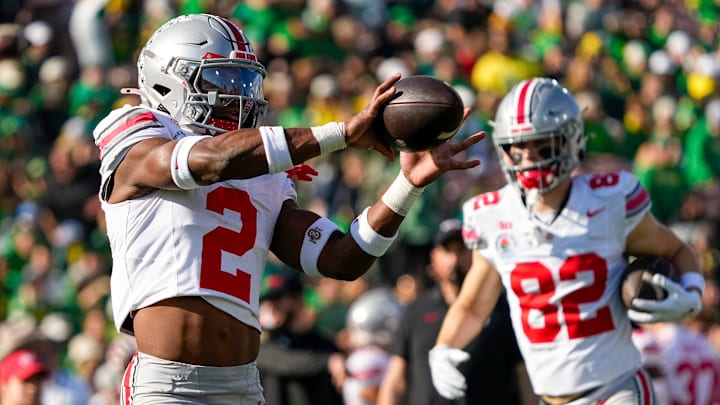 Ohio State Buckeyes safety Caleb Downs (2) catches a ball during warm ups prior to the College Football Playoff quarterfinal against the Oregon Ducks at the Rose Bowl in Pasadena, Calif. on Jan. 1, 2025.