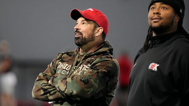 Ohio State Buckeyes head coach Ryan Day admires the new banners on the wall alongside Tyliek Williams during spring football practice at the Woody Hayes Athletic Center on March 17, 2025.