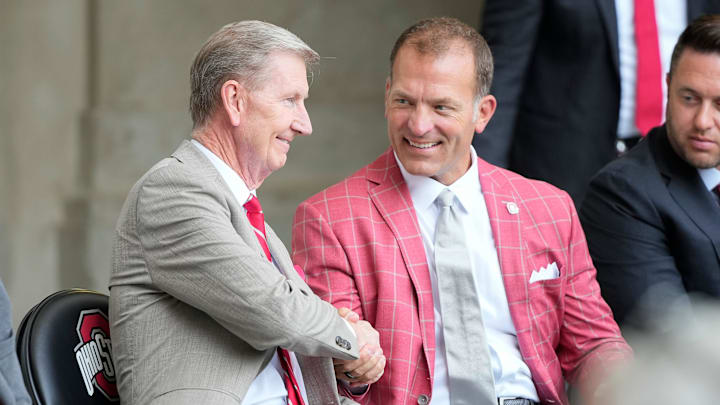 Aug 30, 2024; Columbus, OH, USA; Ohio State president Ted Carter and athletic director Ross Bjork attend the unveiling of a statue for former Buckeyes running back Archie Griffin outside Ohio Stadium.