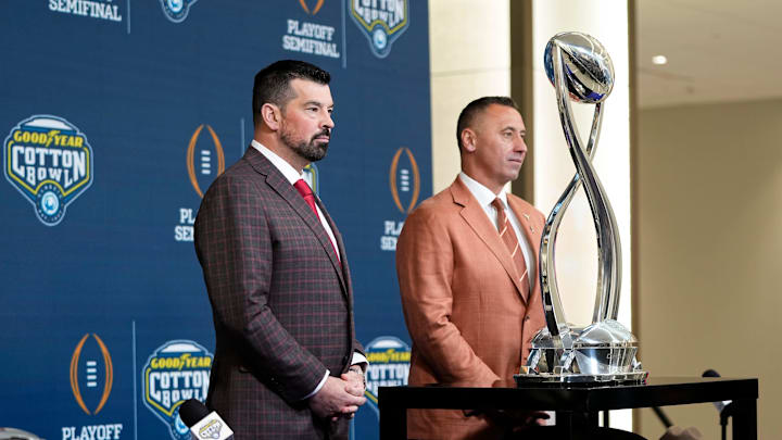 Ohio State Buckeyes head coach Ryan Day and Texas Longhorns head coach Steve Sarkisian stand together following a press conference at AT&T Stadium prior to the College Football Playoff semifinal at the Cotton Bowl Classic in Arlington, Texas on Jan. 9, 2025.
