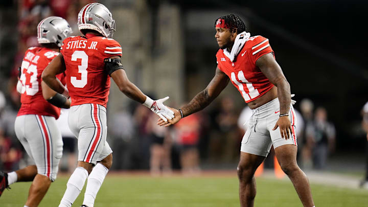 Ohio State Buckeyes linebacker C.J. Hicks (11) high fives cornerback Lorenzo Styles Jr. (3) during the first half of the NCAA football game against the Minnesota Golden Gophers at Ohio Stadium in Columbus on Oct. 4, 2025.
