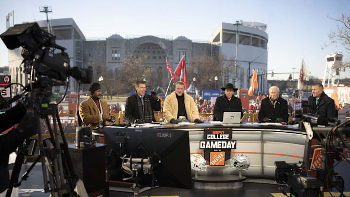 ESPN cast, from left, Desmond Howard, Rece Davis, Pat McAfee, Nick Saban, Lee Corso and Kirk Herbstreit sit on the set of College GameDay prior to the College Football Playoff first round game between the Ohio State Buckeyes and Tennessee Volunteers in Columbus on Dec. 21, 2024.