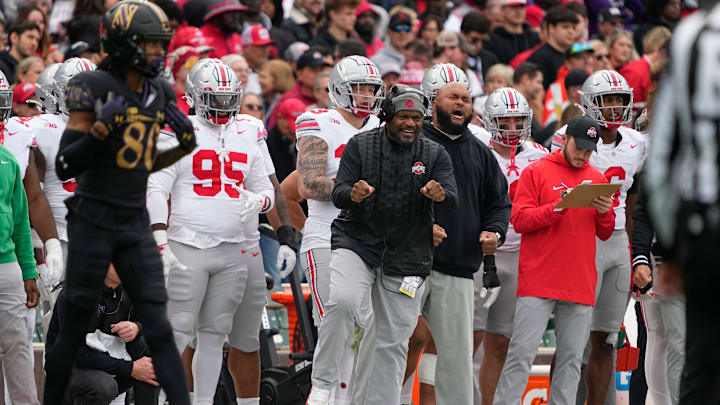 Ohio State Buckeyes defensive line coach Larry Johnson cheers from the sideline during the first half of the NCAA football game against the Northwestern Wildcats at Wrigley Field in Chicago on Saturday, Nov. 16, 2024.