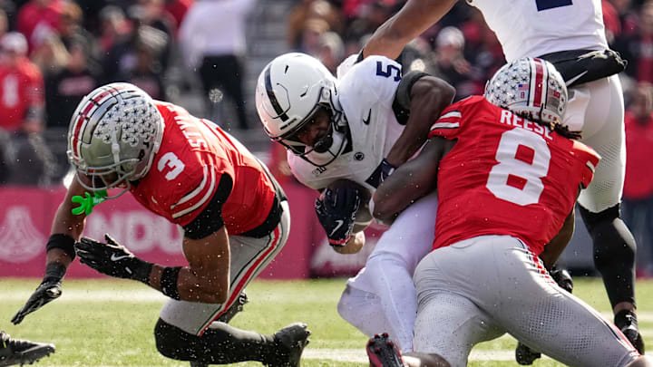 Ohio State Buckeyes linebacker Arvell Reese (8) hits Penn State Nittany Lions wide receiver Devonte Ross (5) beside cornerback Lorenzo Styles Jr. (3) during the NCAA football game at Ohio Stadium in Columbus on Nov. 1, 2025.