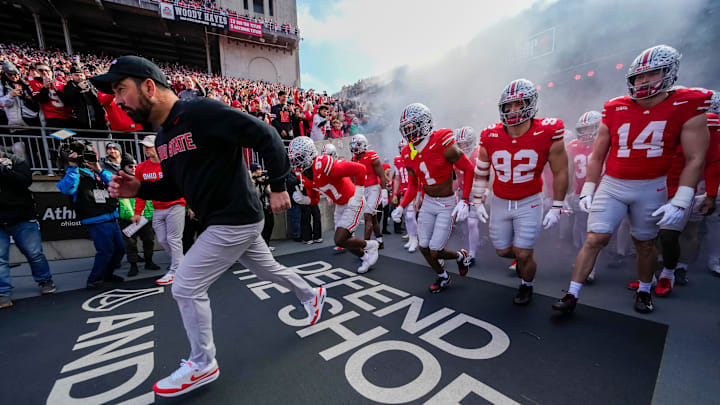 Ohio State Buckeyes head coach Ryan Day leads his team onto the field prior to the NCAA football game against the Rutgers Scarlet Knights at Ohio Stadium in Columbus on Nov. 22, 2025.