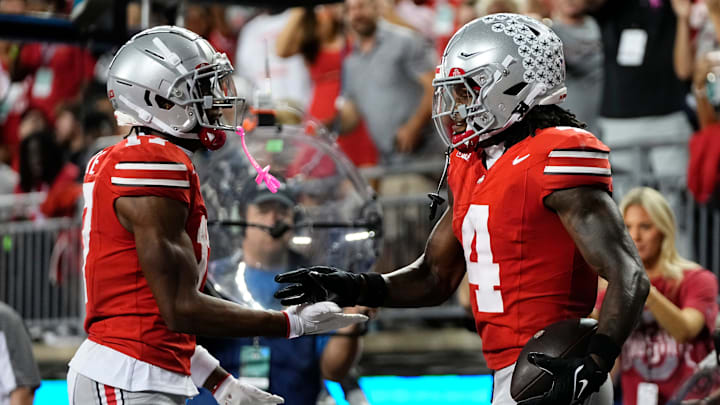 Ohio State Buckeyes wide receiver Carnell Tate (17) celebrates a touchdown by wide receiver Jeremiah Smith (4) during the first half of the NCAA football game against the Minnesota Golden Gophers at Ohio Stadium in Columbus on Oct. 4, 2025.