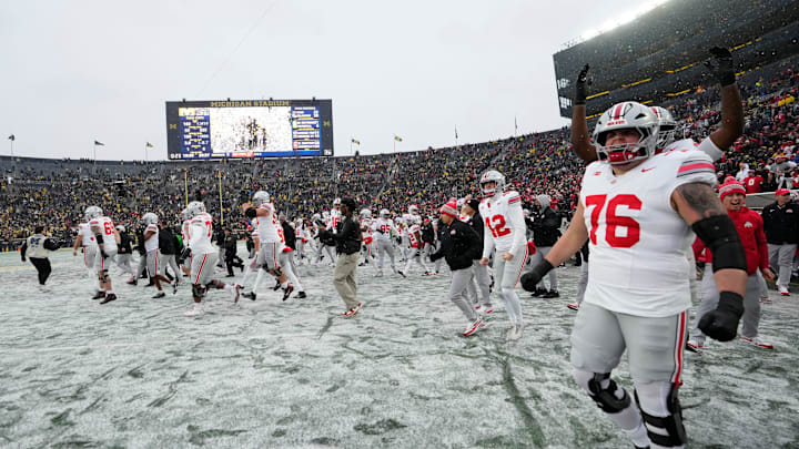 The Ohio State Buckeyes celebrate following the NCAA football game against the Michigan Wolverines at Michigan Stadium in Ann Arbor, Mich. on Nov. 29, 2025. Ohio State won 27-9.