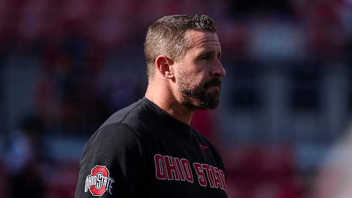 Ohio State Buckeyes offensive coordinator Brian Hartline leads warm ups prior to the NCAA football game against the Rutgers Scarlet Knights at Ohio Stadium in Columbus on Nov. 22, 2025. Ohio State Buckeyes offensive coordinator Brian Hartline leads warm ups prior to the NCAA football game against the Rutgers Scarlet Knights at Ohio Stadium in Columbus on Nov. 22, 2025.