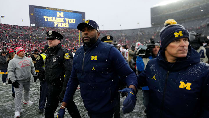Michigan Wolverines head coach Sherrone Moore leaves the field following the NCAA football game against the Ohio State Buckeyes at Michigan Stadium in Ann Arbor, Mich. on Nov. 29, 2025. Ohio State won 27-9. Michigan Wolverines head coach Sherrone Moore leaves the field following the NCAA football game against the Ohio State Buckeyes at Michigan Stadium in Ann Arbor, Mich. on Nov. 29, 2025. Ohio State won 27-9.