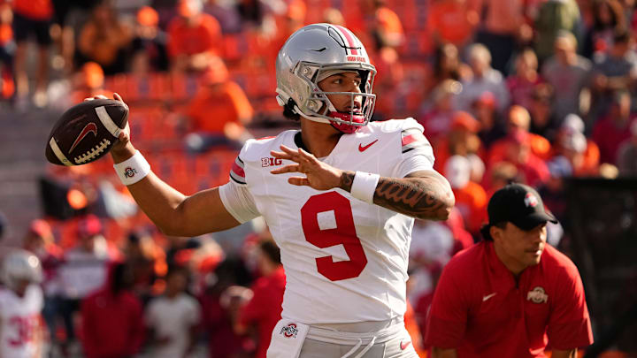 Ohio State Buckeyes quarterback Tavien St. Clair (9) warms up prior to the NCAA football game against the Illinois Fighting Illini at Gies Memorial Stadium in Champaign on Oct. 11, 2025. Ohio State Buckeyes quarterback Tavien St. Clair (9) warms up prior to the NCAA football game against the Illinois Fighting Illini at Gies Memorial Stadium in Champaign on Oct. 11, 2025.