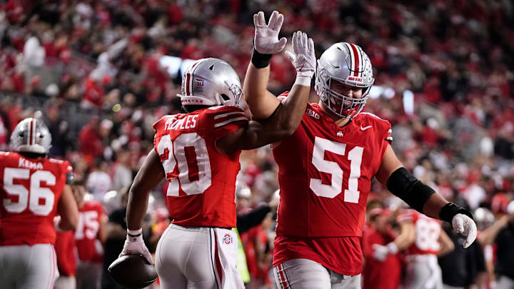 Ohio State Buckeyes running back James Peoples (20) celebrates a touchdown with offensive lineman Luke Montgomery (51) during the NCAA football game against the UCLA Bruins at Ohio Stadium in Columbus on Nov. 15, 2025. Ohio State won 48-10.