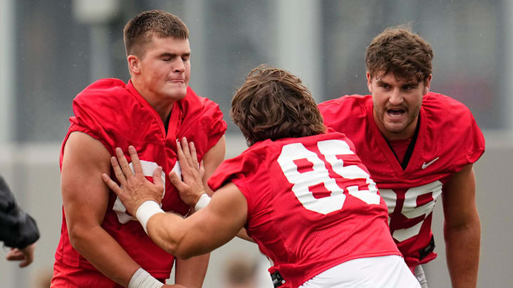 Ohio State Buckeyes tight end Bennett Christian (85) hits tight end Nate Roberts (83) during the first football practice of the season at the Woody Hayes Athletic Center on July 31, 2025. Ohio State Buckeyes tight end Bennett Christian (85) hits tight end Nate Roberts (83) during the first football practice of the season at the Woody Hayes Athletic Center on July 31, 2025.