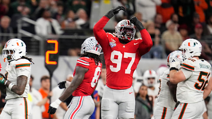 Ohio State Buckeyes defensive end Kenyatta Jackson Jr. (97) reacts during the Cotton Bowl at AT&T Stadium in Arlington, Texas for the College Football Playoff quarterfinal game against the Miami Hurricanes on Dec. 31, 2025. Ohio State lost 24-14.