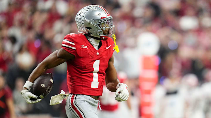 Ohio State Buckeyes cornerback Davison Igbinosun (1) celebrates an interception during the first half of the Big Ten Conference championship game against the Indiana Hoosiers at Lucas Oil Stadium in Indianapolis on Dec. 6, 2025.