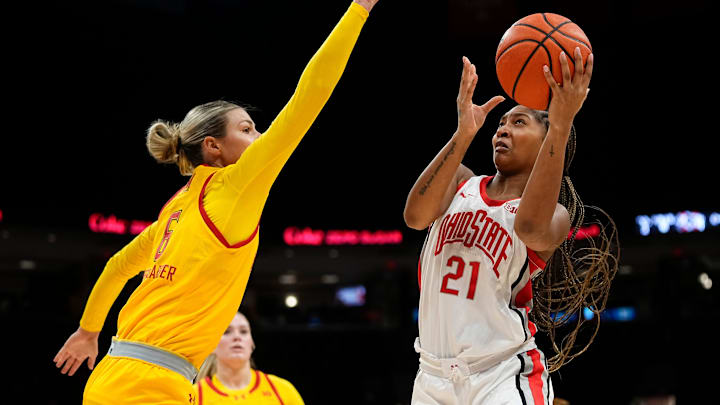 Ohio State Buckeyes guard Chance Gray (21) shoots around Maryland Terrapins guard Saylor Poffenbarger (6) during the second half of the NCAA women's basketball game at Value City Arena on Jan. 23, 2025. Ohio State won 74-66.