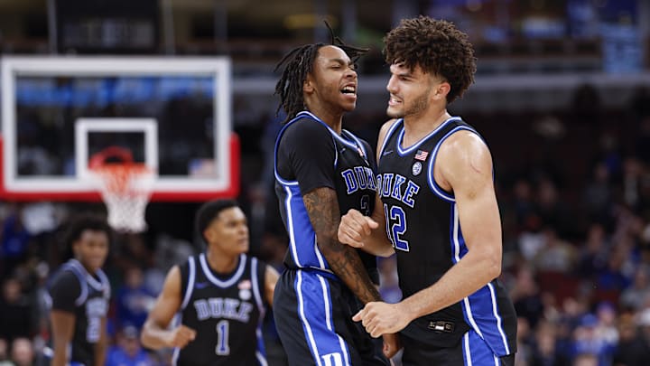 Nov 27, 2025; Chicago, Illinois, USA; Duke basketball forward Cameron Boozer (12) celebrates with guard Isaiah Evans (3) during the second half at United Center.